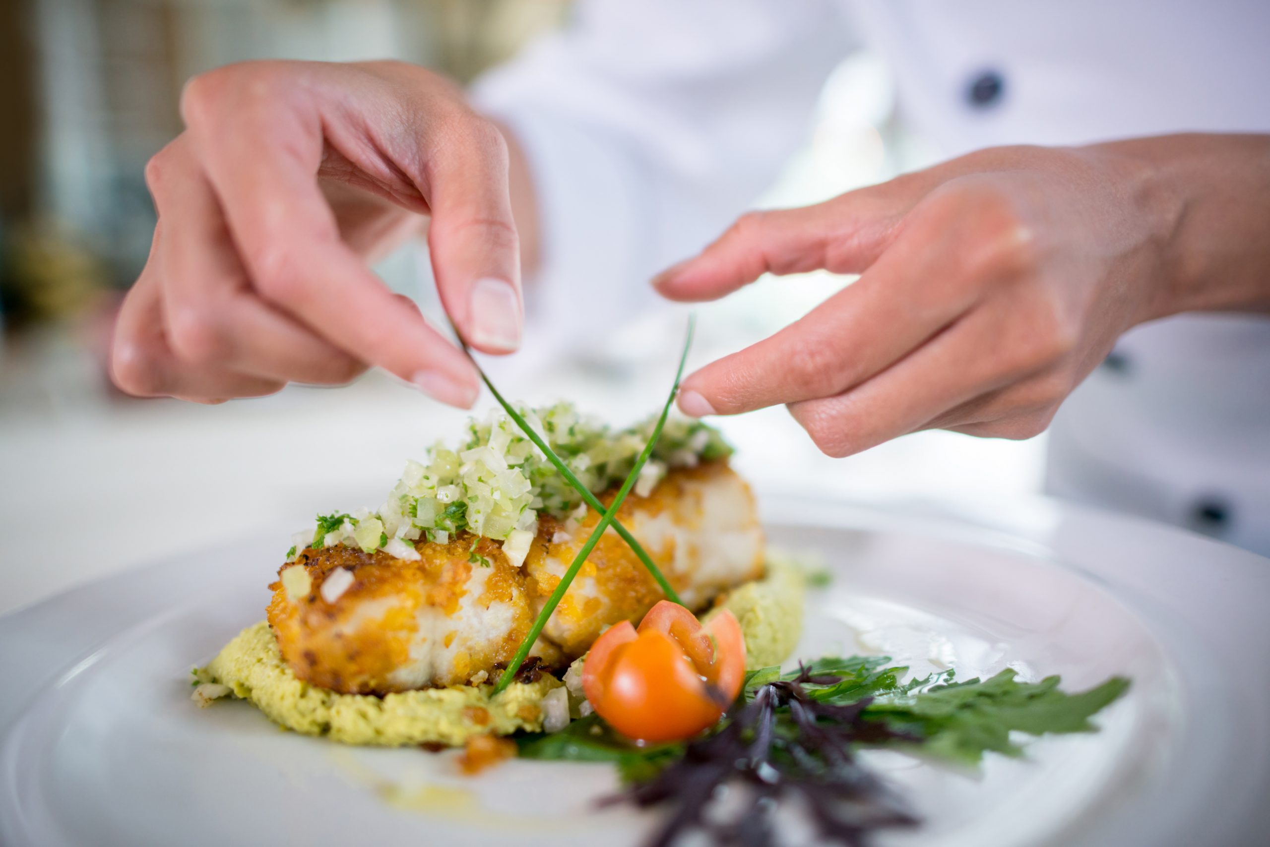 Close up of a Chef decorating a plate