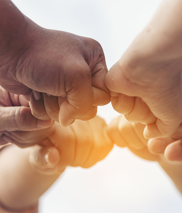 Close up hands Teamwork group of multi racial people meeting join hands. Diversity people hands join empower partnership teams connect volunteer community. Diverse multiethnic Partners team together Doctor and nurse sitting on sofa